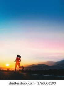 Young Fitness Asian Woman Is Running And Jogging An Outdoor Workout On The Road In The Morning For Lifestyle Health.