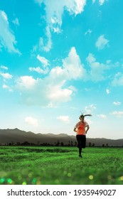 Young Fitness Asian Woman Is Running And Jogging An Outdoor Workout On The Countryside In The Morning For Lifestyle Health.