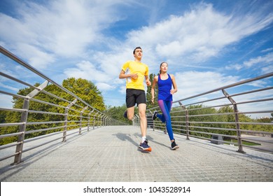 Young Fitness Couple Running Outdoors