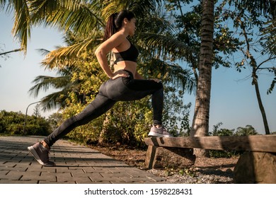 Young Fitness Girl Doing Standing Hamstring Stretch After A Run In Park Near Hanoi Vietnam