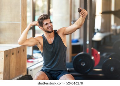 Young Fitness Man Makes Selfie In Gym
