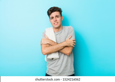 Young fitness teenager man going cold due to low temperature or a sickness. - Powered by Shutterstock