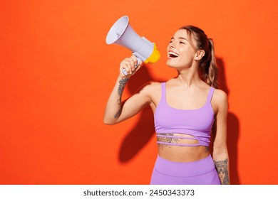 Young fitness trainer sporty woman sportsman wear purple top clothes in home gym scream in megaphone announces discounts sale Hurry up isolated on plain orange background Workout sport fit abs concept - Powered by Shutterstock