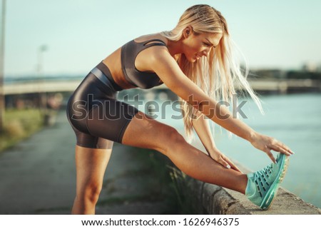 Similar – Happy fit woman taking a break from jogging