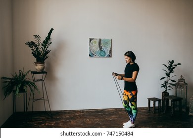 Young Fitness Woman Jumping Rope At Home