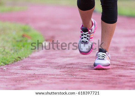 young fitness woman legs running