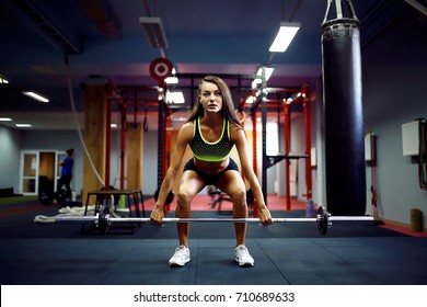 Young Fitness Woman Lifting A Weight Crossfit In The Gym. Fitness Woman Deadlift Barbell. Crossfit Woman. Crossfit Style. Crossfit And Fitness