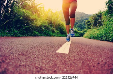 Young Fitness Woman Runner Legs Running At Forest Trail 