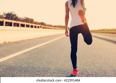 Young Fitness Woman Runner Warm Up On Road