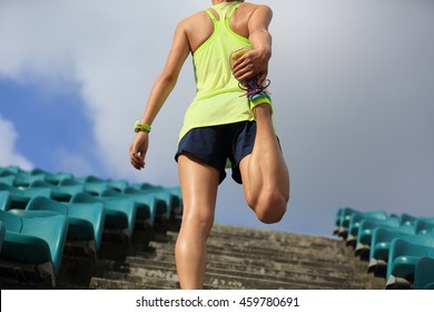 Young Fitness Woman Runner Warm Up On Stairs