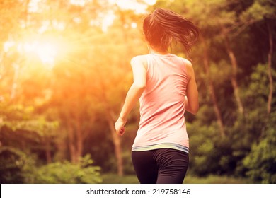 Young Fitness Woman Running At Forest Trail 