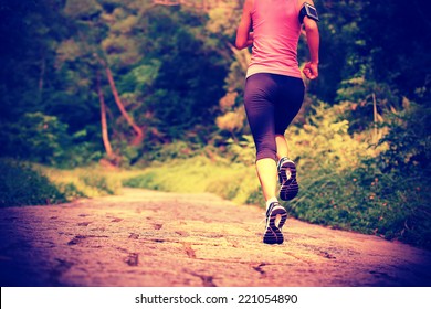 Young Fitness Woman Running At Forest Trail 