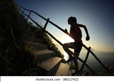 Young Fitness Woman Trail Runner Running Up On Mountain Stairs