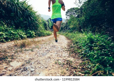 Young Fitness Woman Ultra Marathon Runner Running On Rocky Mountain Trail