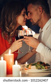 Young Flirting Beautiful Lady In Red Dress Kiss Her Gorgeous Man While Have Romantic Dinner At Home