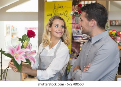 Young Florist Advising A Customer For A Bouquet