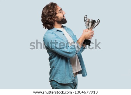 young fool man with a trophy