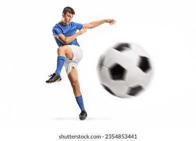 Young football player kicking a ball isolated on white background - Powered by Shutterstock