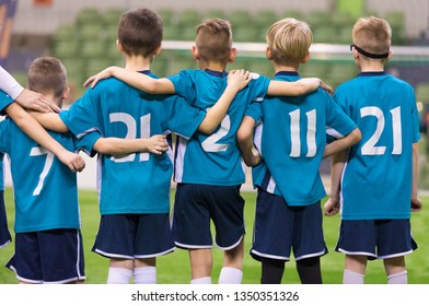 Young Football Players. Young Soccer Team Supporting Friends During Penalty Kicks. Soccer Match For Children. Young Boys Playing Tournament Soccer Match. Youth Soccer Club Footballers - Powered by Shutterstock