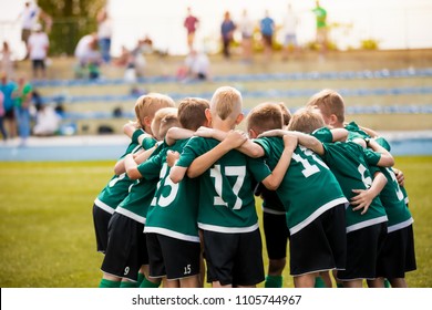 Young Football Soccer Players In Sportswear. Young Sports Team With Football Coach. Pep Talk With Coach Before The Final Match. Soccer School Tournament