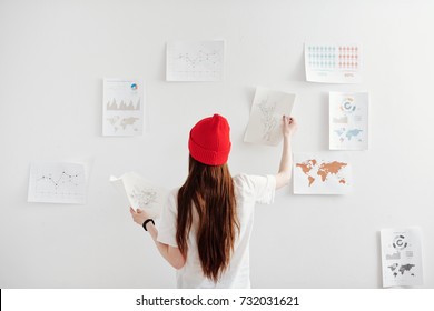 Young freelance designer working on creating infographics - Shutterstock ID 732031621