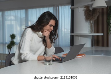 Young Freelancer Business Woman Expert For Online Marketing Working At Home. Female Businessperson Reading Mail And Surfing The Internet Searching For Best Opportunity To Invest Her Money.