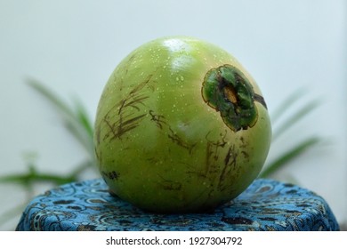 Young fresh coconut on a batik cloth. - Powered by Shutterstock