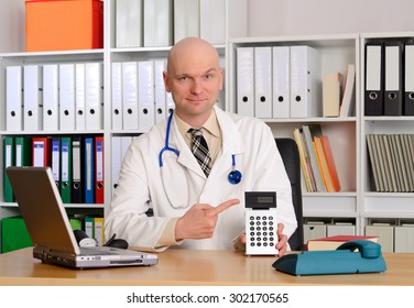 Young Friendly Doctor In Her Office With Pocket Calculator