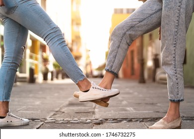 Young Friends Doing New Social Distancing Greetings With Foots For Preventing Corona Virus Outbreak - Physical Distance And Safety Greetings Concept 