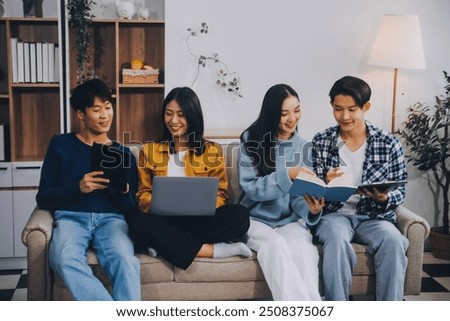 Young friends doing school assignment together at home