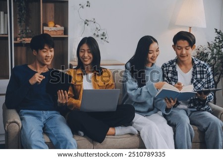 Young friends doing school assignment together at home