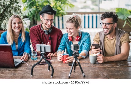 Young friends group sharing info on streaming platform with webcam - Startup marketing concept with millennial guys and girls having fun vlogging live talk feed on social media network - Bright filter - Shutterstock ID 1610679976