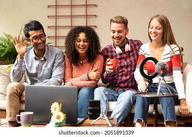 Young friends group sharing info on streaming platform with webcam - Community concept with multicultural and multiethnic friends having fun vlogging live - Diversity and technology concept