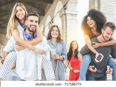 Young Friends Having Fun In Old City Center - Happy Students At University Break Laughing Together - Youth, School And Friendship Concept - Focus On Center Woman Holding Coffee Paper Cup - Warm Filter