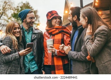 Young Friends Having Fun Outdoor In The City In Winter Day - Focus On Left Man Face