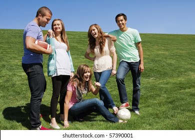 Young Friends Having Fun Together And Playing Sports