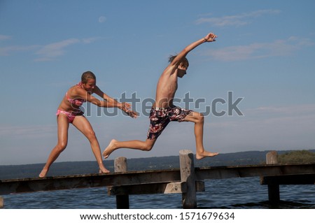 Similar – Image, Stock Photo Girl on jetty Joy Summer