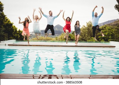 Young Friends And Jumping In The Swimming Pool