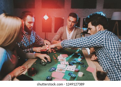 Similar Images Stock Photos Vectors Of Young People Play Poker At The Table On The Table They Have Glasses With Alcoholic Beverages Mobile Phones And Chips For The Game They Have