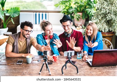 Young friends startupper group having fun on streaming platform with webcam - Start up marketing concept with millennial guys and girls vlogging live talk feed on social media network - Bright filter - Shutterstock ID 1845643531