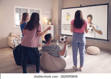 Young Friends Watching Sports At Home