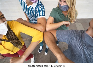 Young Friends Wearing Face Mask Doing New Social Distancing Greet With Elbows Bumps For Preventing Corona Virus Spread - Physical Distance And Friendship Safety Greetings Concept 