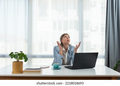 Young frustrated business woman office worker trying to concentrate for her work while she sitting in the company office with old laptop computer and slow internet connection.