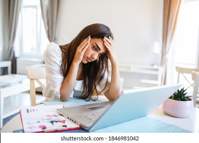 Young Frustrated Woman Working From Home Office In Front Of Laptop Suffering From Chronic Daily Headaches, Treatment Online, Appointing To A Medical Consultation, Electromagnetic Radiation, Sick Pay