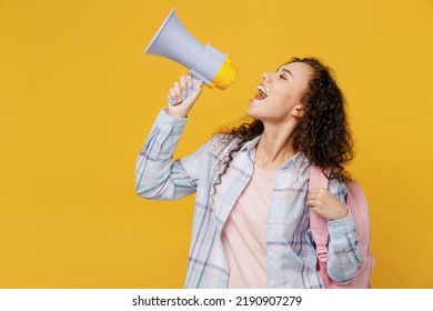 Young fun black teen girl student she wear casual clothes backpack bag hold scream in megaphone discounts sale Hurry up isolated on plain yellow color background High school university college concept - Shutterstock ID 2190907279