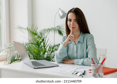 Young Fun Employee Business Woman In Blue Shirt Say Hush Be Quiet With Finger On Lips Shhh Gesture Sit Work At Workplace White Desk With Laptop Pc Computer At Office Indoors Achievement Career Concept