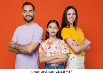 Young Fun Happy Parents Mom Dad With Child Kid Daughter Teen Girl In Basic T-shirts Hold Hands Crossed Folded Isolated On Yellow Background Studio Portrait. Family Day Parenthood Childhood Concept.