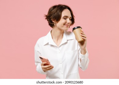 Young Fun Successful Employee Business Woman Corporate Lawyer In Classic Formal White Shirt Work In Office Hold Takeaway Delivery Craft Paper Brown Cup Coffee To Go Isolated On Pastel Pink Background.