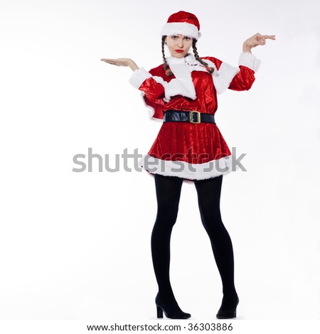 young funny and expressive woman dressed as santa claus is doing her shopping