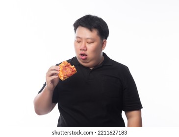 Young Funny Fat Asian Man Eating Hawaiian Pizza Isolated On White Background, Unhealthy Concept.